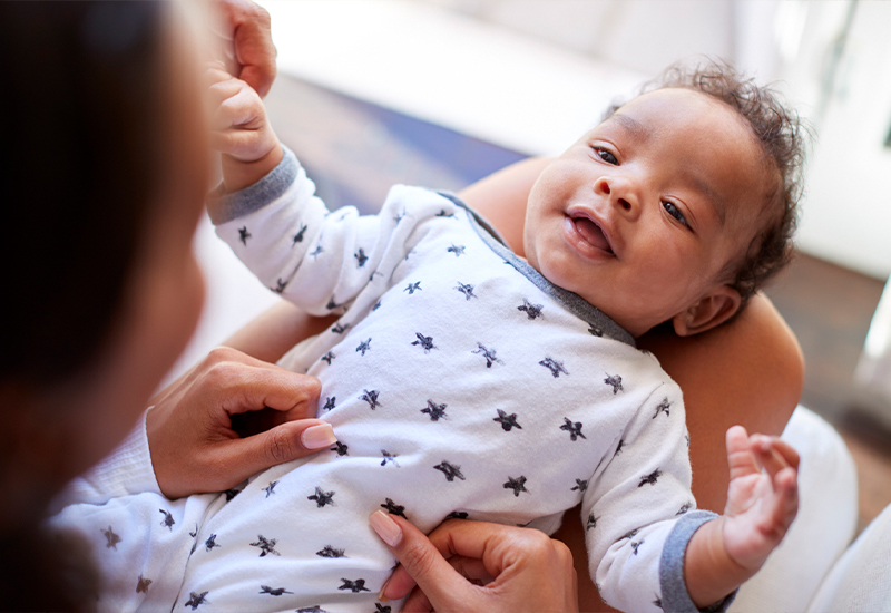 Baby laying in mom's lap
