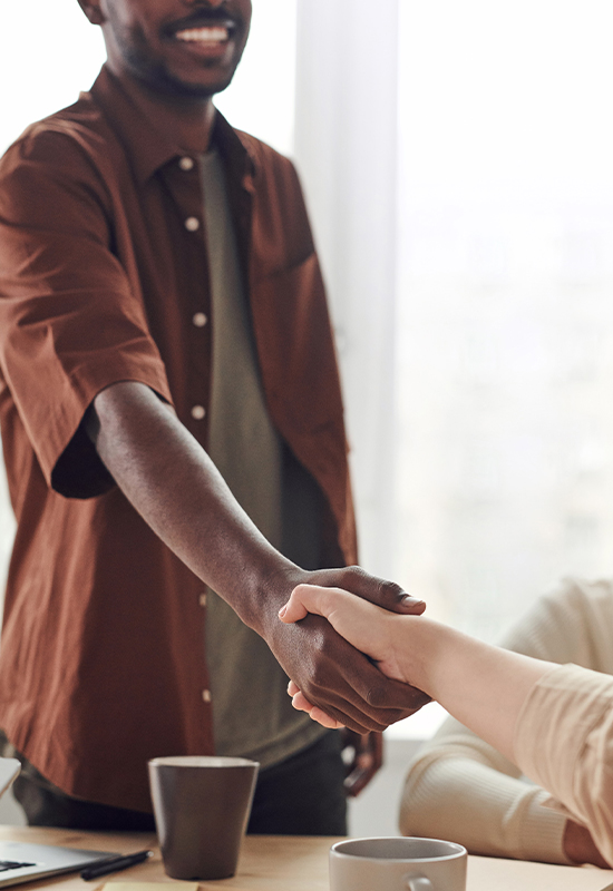 Handshake between two diverse humans