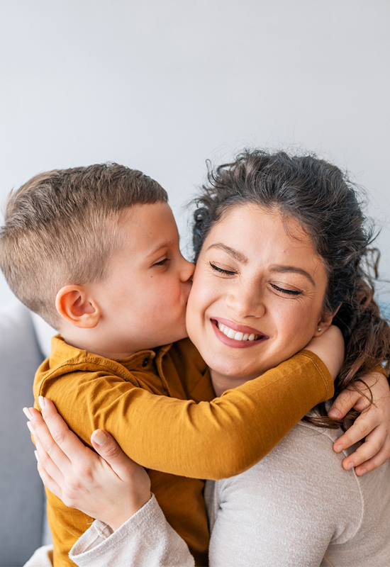 MomandSOn Son kissing mother on cheek
