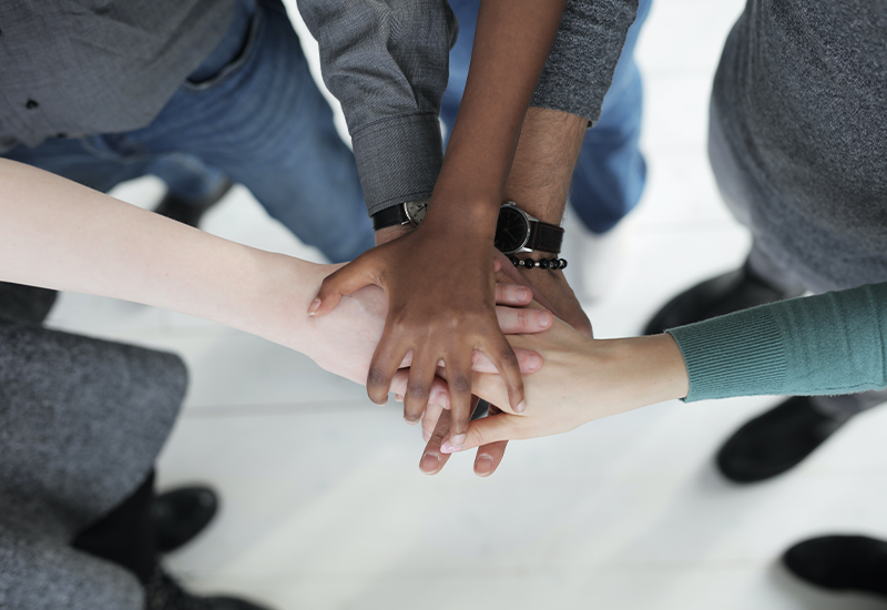 Hands joined together as a team