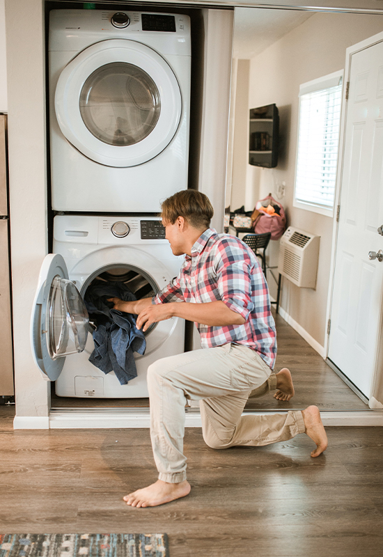Adult male washing clothes
